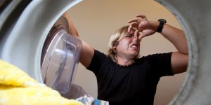 Workout gear is made from synthetic fibers that require special detergent for the proteins excreted during vigorous exercise. Even if you double wash your clothes, the smell remains and seems to smell "spoiled" and tends to gets worse.  Win Detergent is a bit pricey but gets the stench out of a workout.